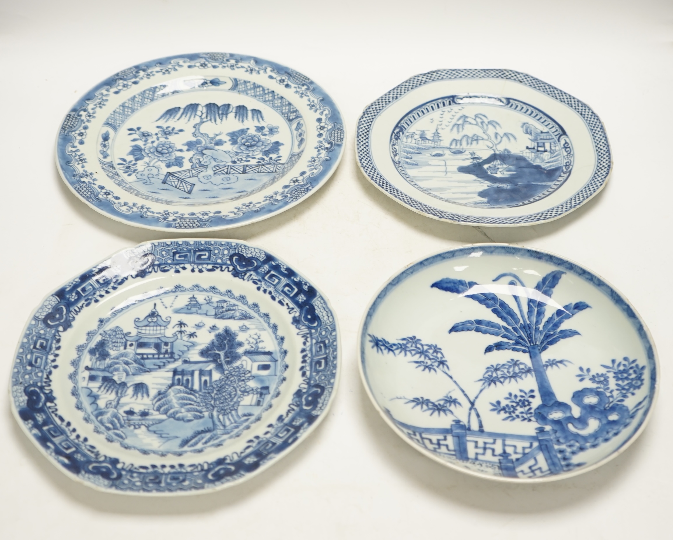 Four various Chinese export blue and white dishes, 18th/19th century, largest 26cm, largest 26cm diameter. Condition - one plate cracked, chips to another